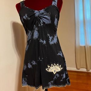 Blue on blue tie-dye with blanket stitch hem.